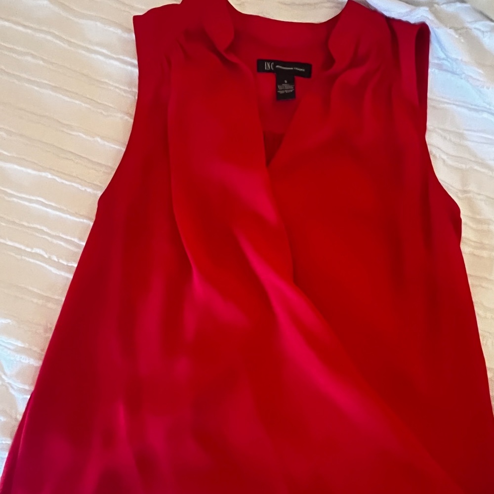 Sleeveless red blouse